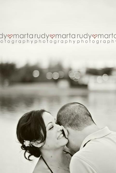 black and white photo laughing engaged bride disney boardwalk