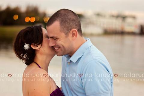 engaged couple smiling session disney boardwalk