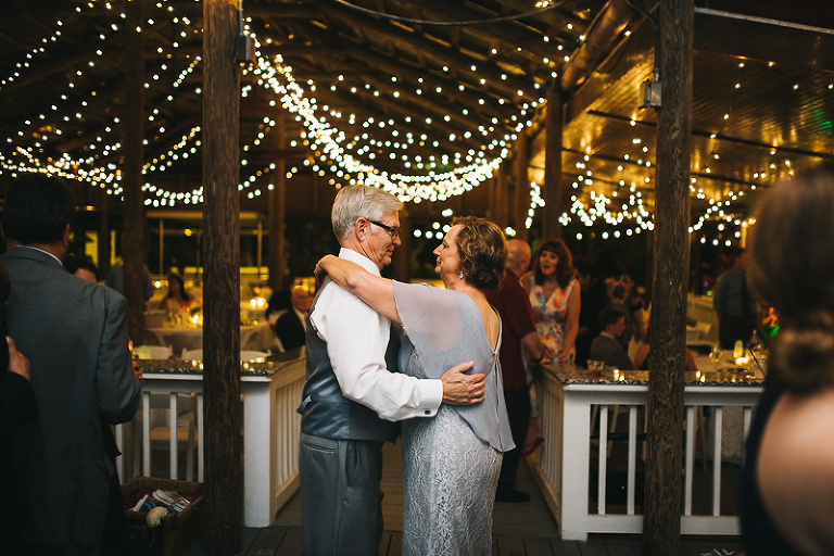 bride parents dancing together