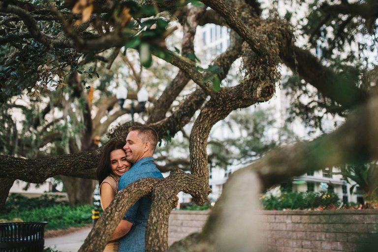 downtown engagement photograph in a tree at lake eola