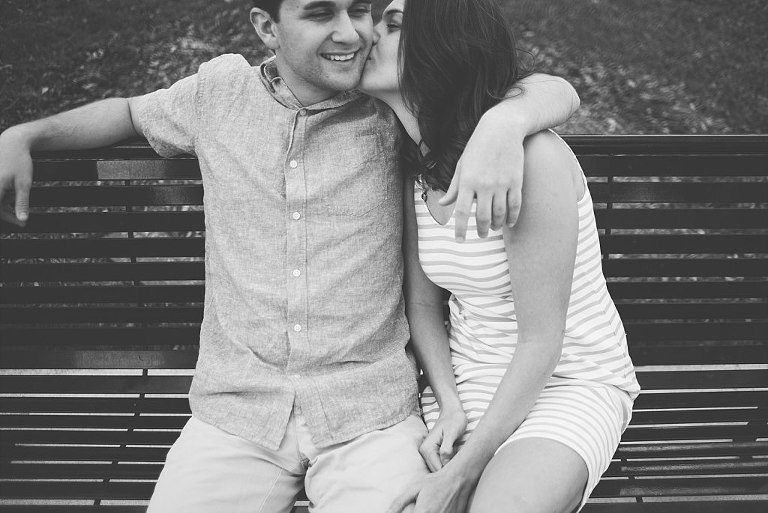 black and white cute candid natural engagement picture couple sitting on bench stetson university deland fl