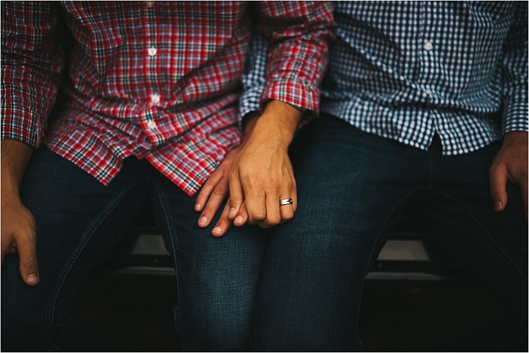 intimate gay engagement picture couple holding hands