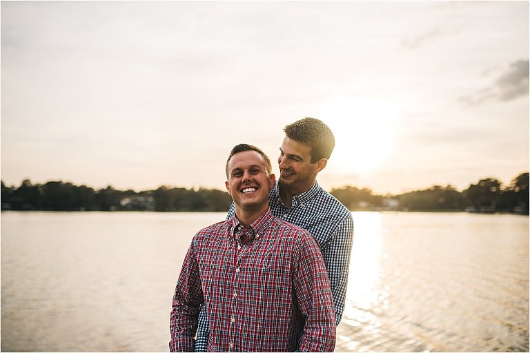 happy samesex couple engagement session rollins college winter park sunset