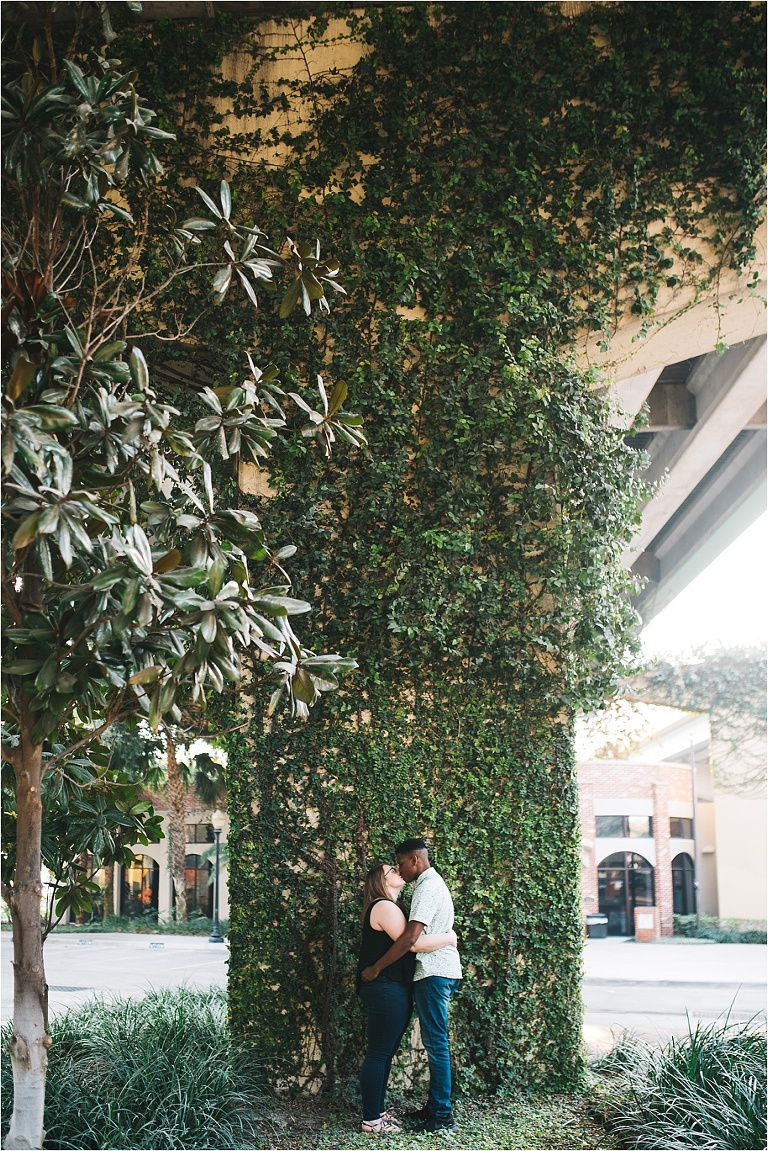 couple having an engagement session under the i4 overpass in downtown orlando