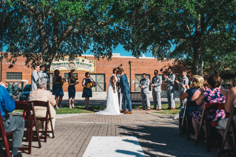 first kiss at wedding in farmers market
