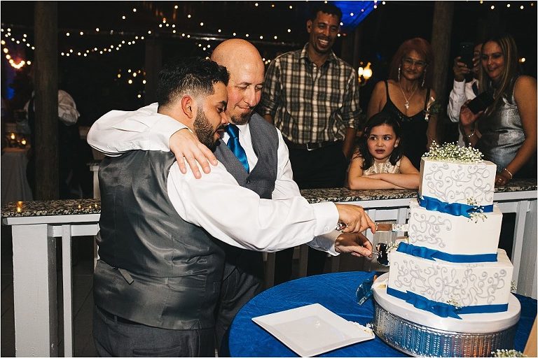 gay couple cutting of the cake