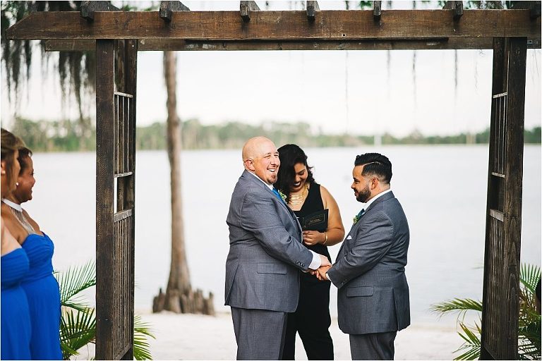 candid moment during gay wedding ceremony