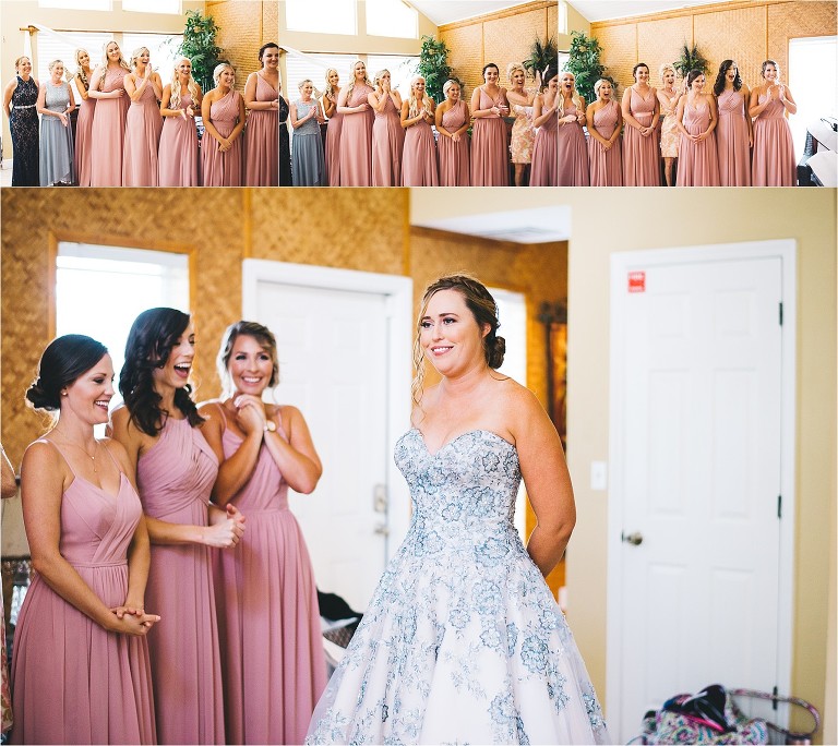 bridal party and mother of the bride seeing bride in dress for the first time
