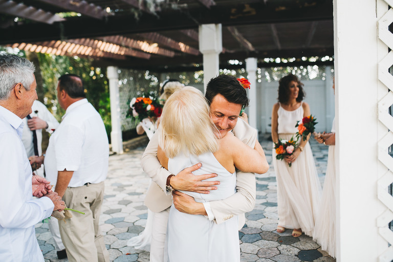 groom hugging bride