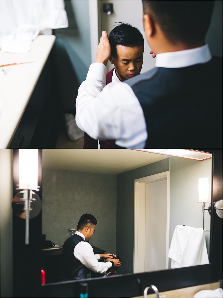 groom helping son get ready for wedding