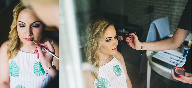 bride getting makeup on while getting ready