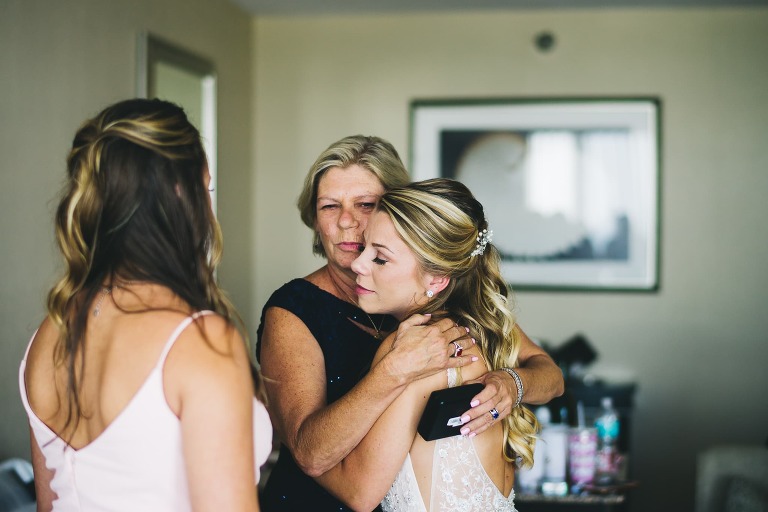 mother of the bride hugging her daughter before the wedding