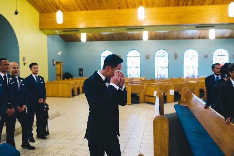 groom crying seeing bride for the first time