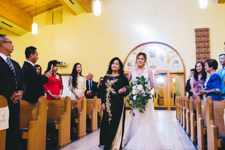mother walking bride down the aisle