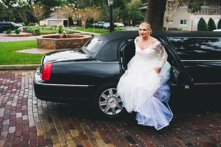 bride getting out of limousine 
