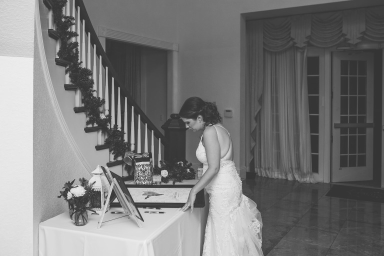 bride looking at guest sign in