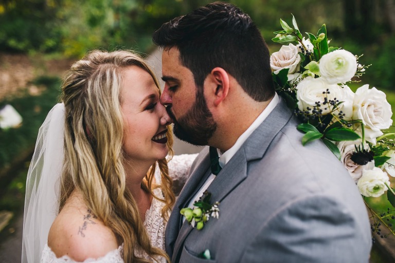 groom kissing bride's nose