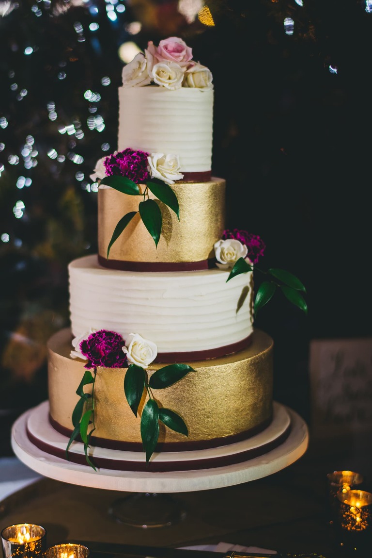 gold burgundy four tier wedding cake